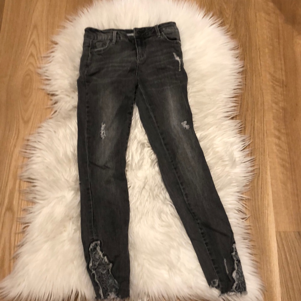 Factory ripped jeans with lace bottoms.